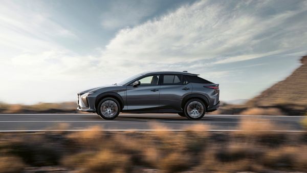 Lexus RZ 450e driving in a mountainous location