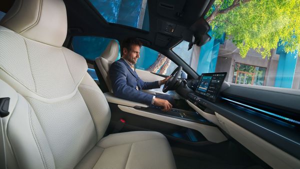 A person sat in a Lexus UX 300e