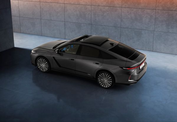 Raised rear three-quarter angle of a parked all-new Lexus ES