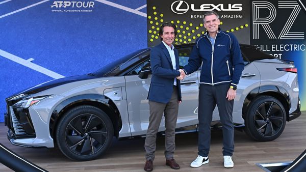 Andre Schmidt (Head of Lexus Europe) and Eno Polo (ATP CEO) shaking hands next to a parked Lexus RZ