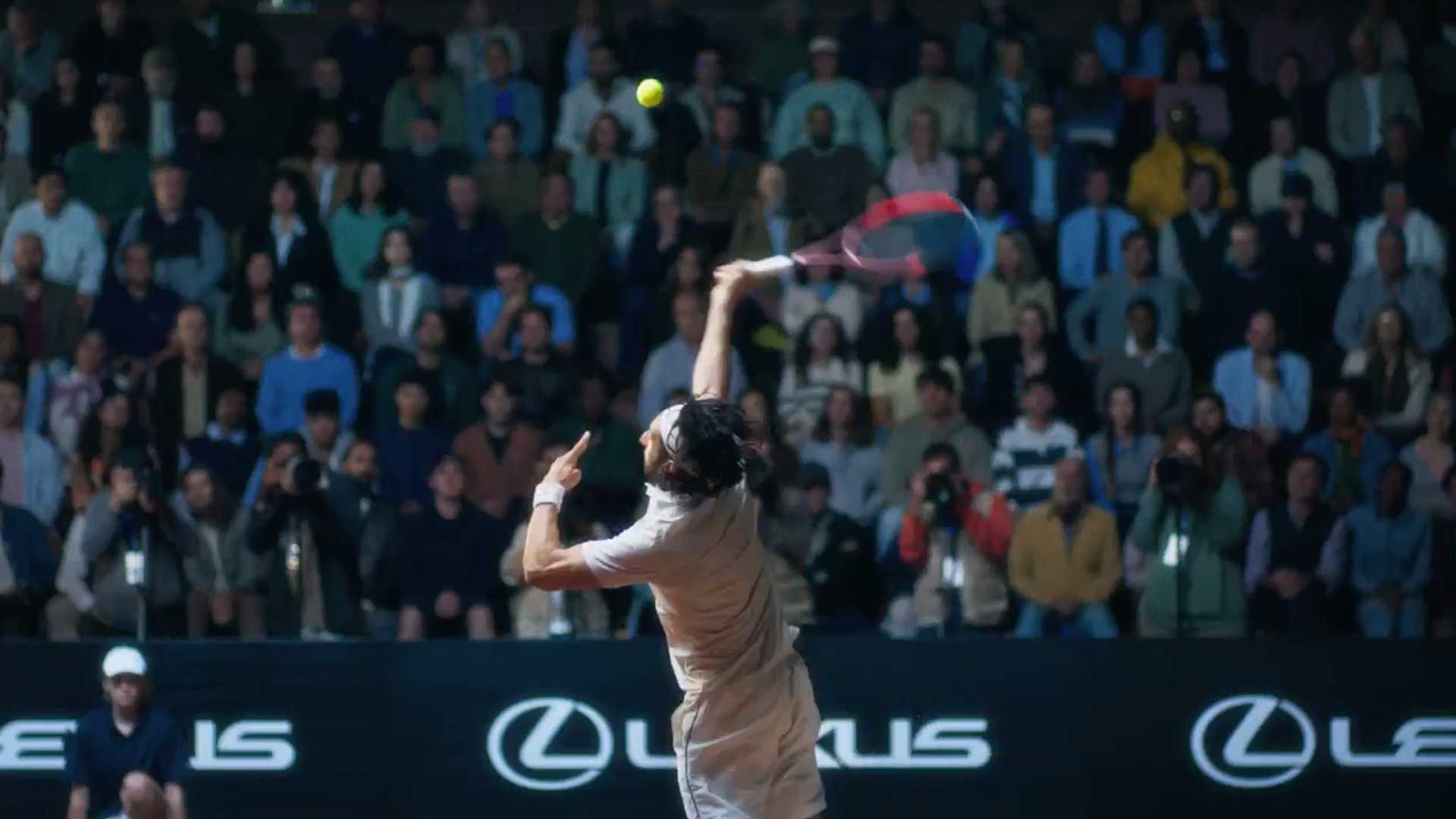 A tennis player serving a ball.