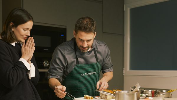 Two people working with food