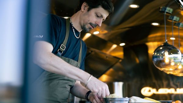 A chef cooking at a Lexus restaurant