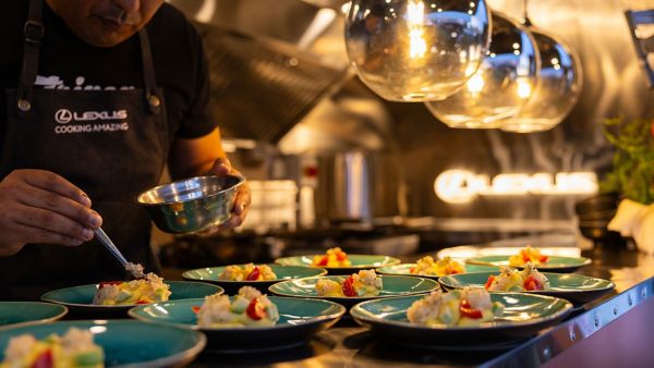 A chef working with food at a Lexus restaurant