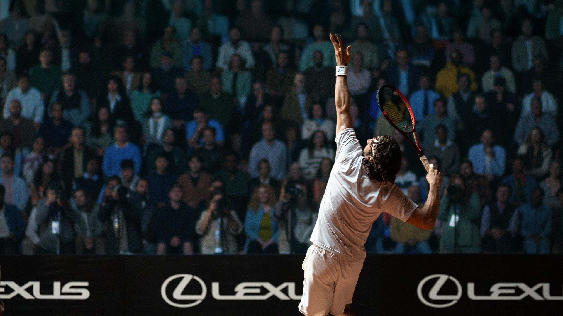A tennis player serving during an ATP event