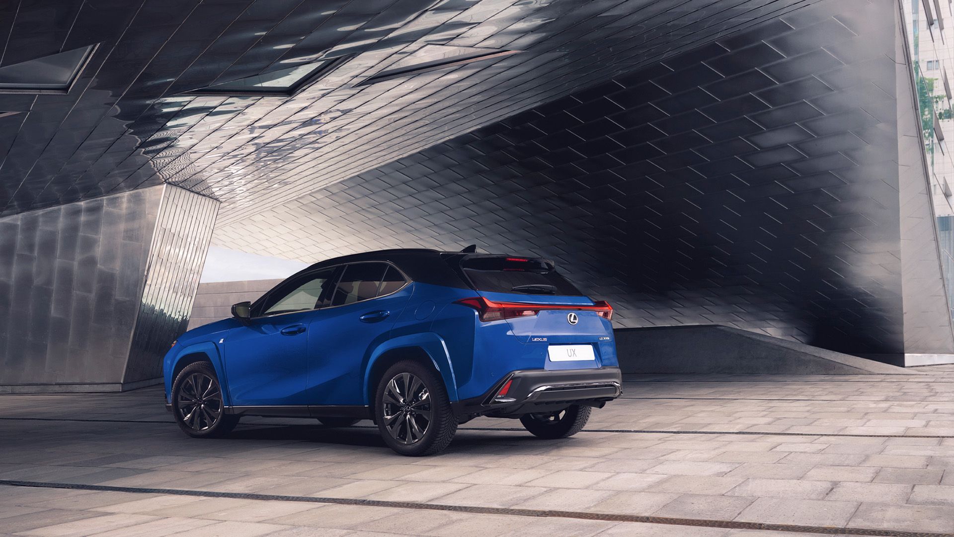 Rear three-quarter view of a parked Lexus UX 300h