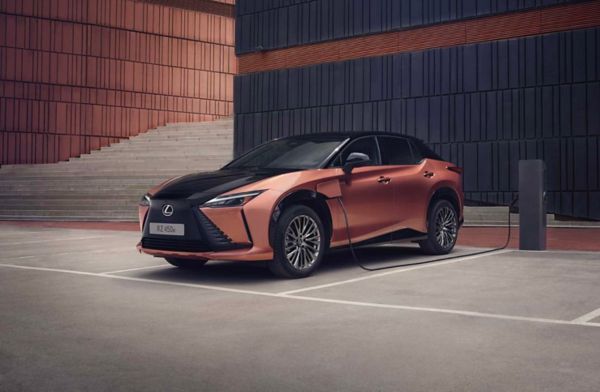 A Lexus RZ plugged into charge point