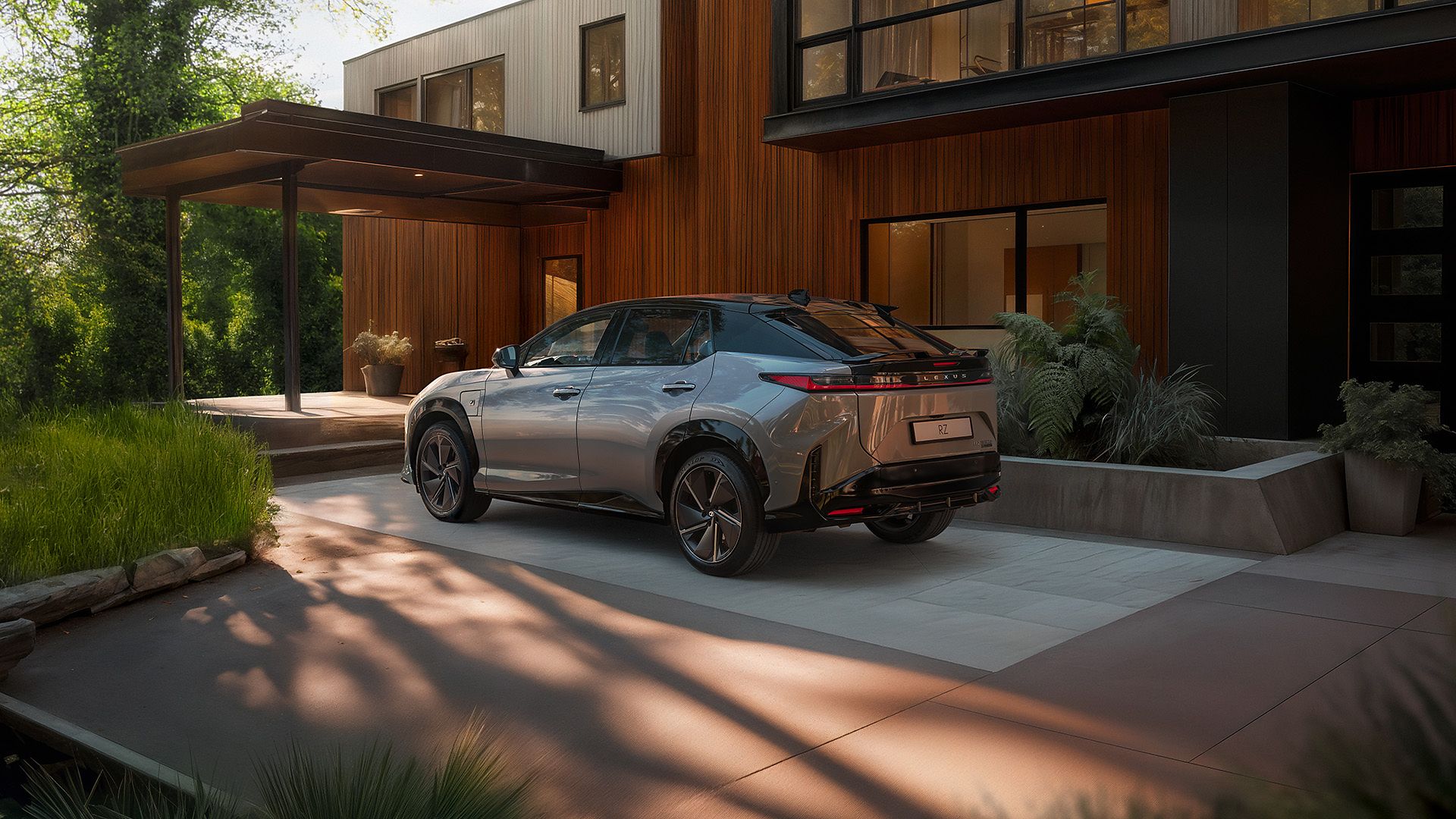 A Lexus RZ parked infront of a property