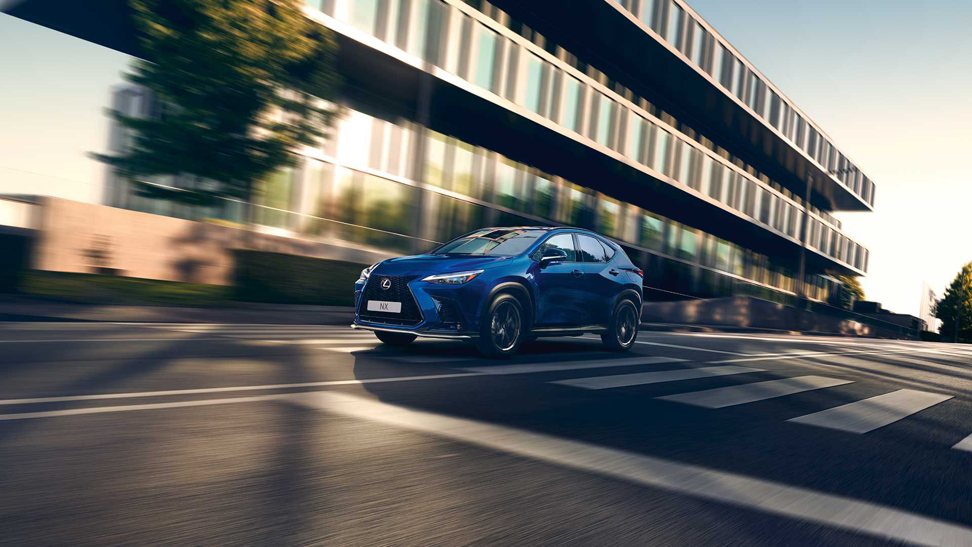 A Lexus NX driving on a road