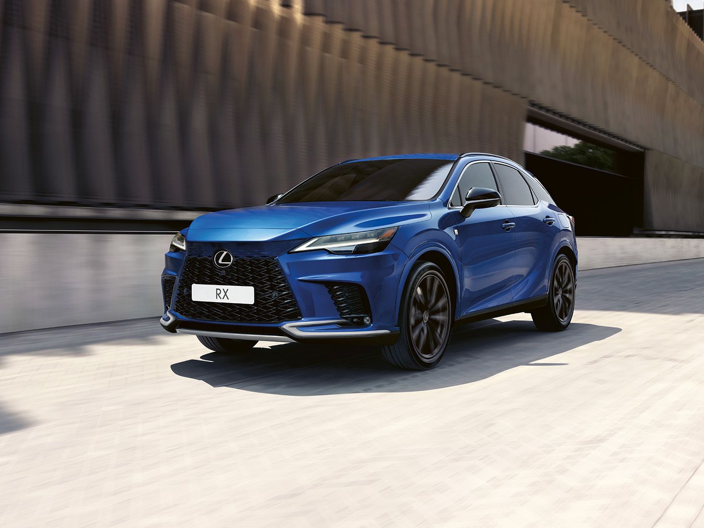 A Lexus RX driving on a road
