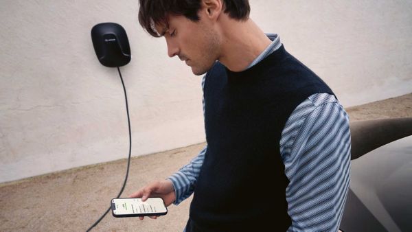 A Lexus NX driving on a hillside road