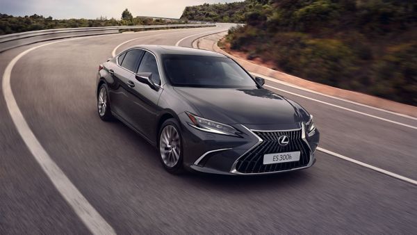 A Lexus ES 300h taking a corner on the rural road