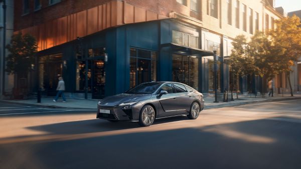 A Lexus ES driving on a road