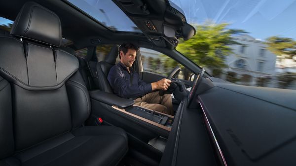 A person driving a Lexus ES