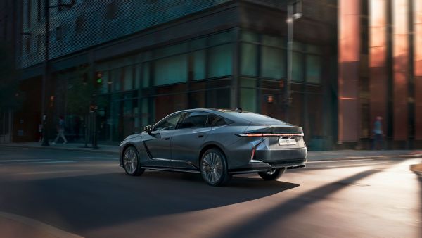 A Lexus ES driving on a road
