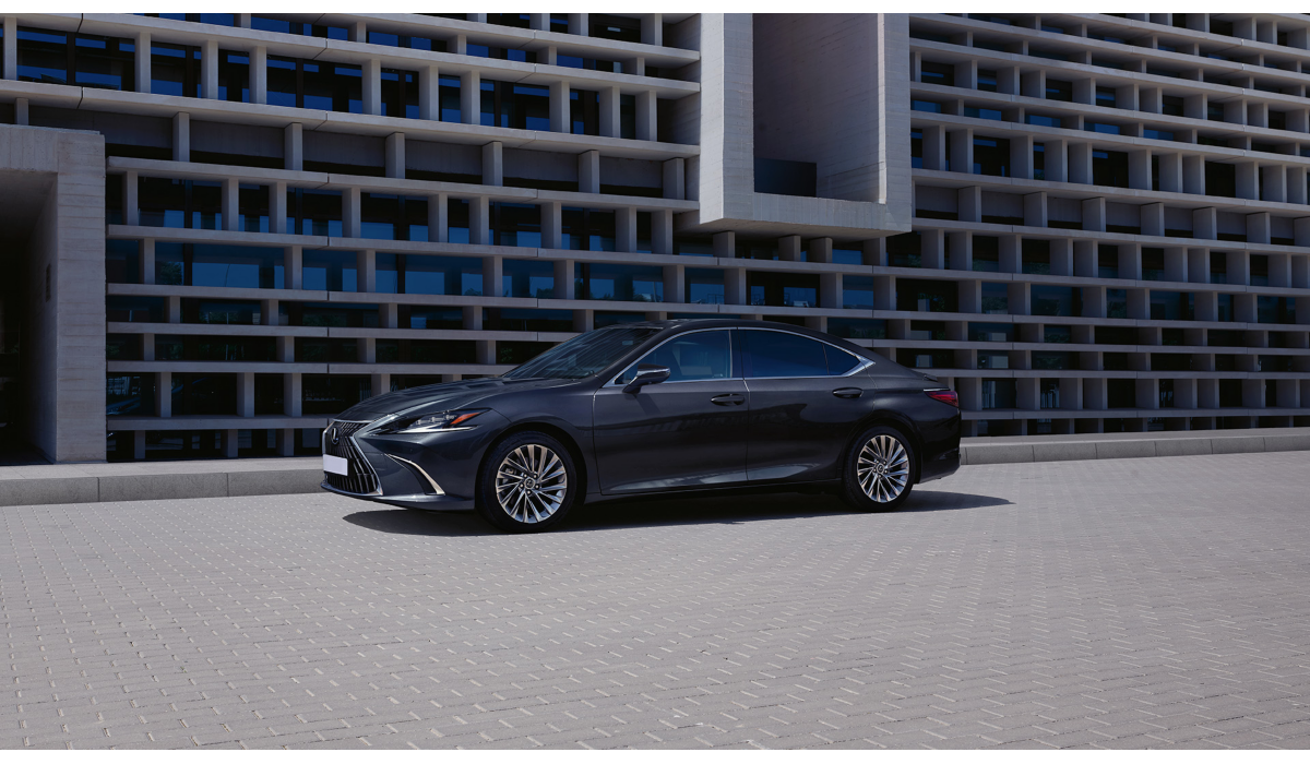 A Lexus ES parked outside a wall