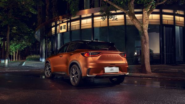 Lexus LBX driving in a town location