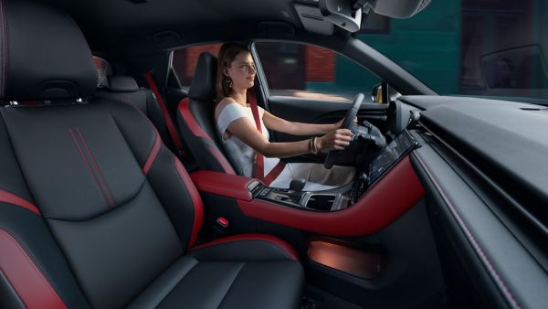 A person driving an LBX Vibrant Edition