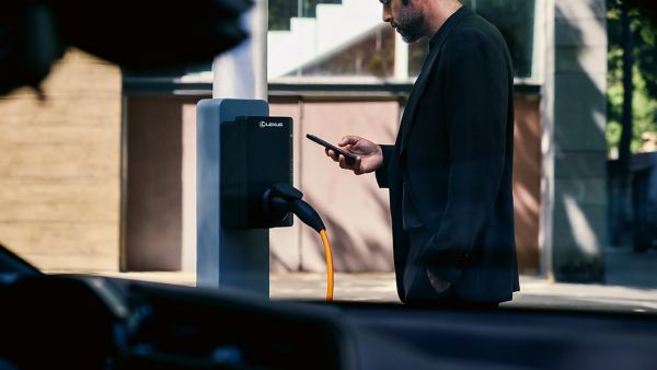 A person using a mobile phone to access the Lexus Link+ app