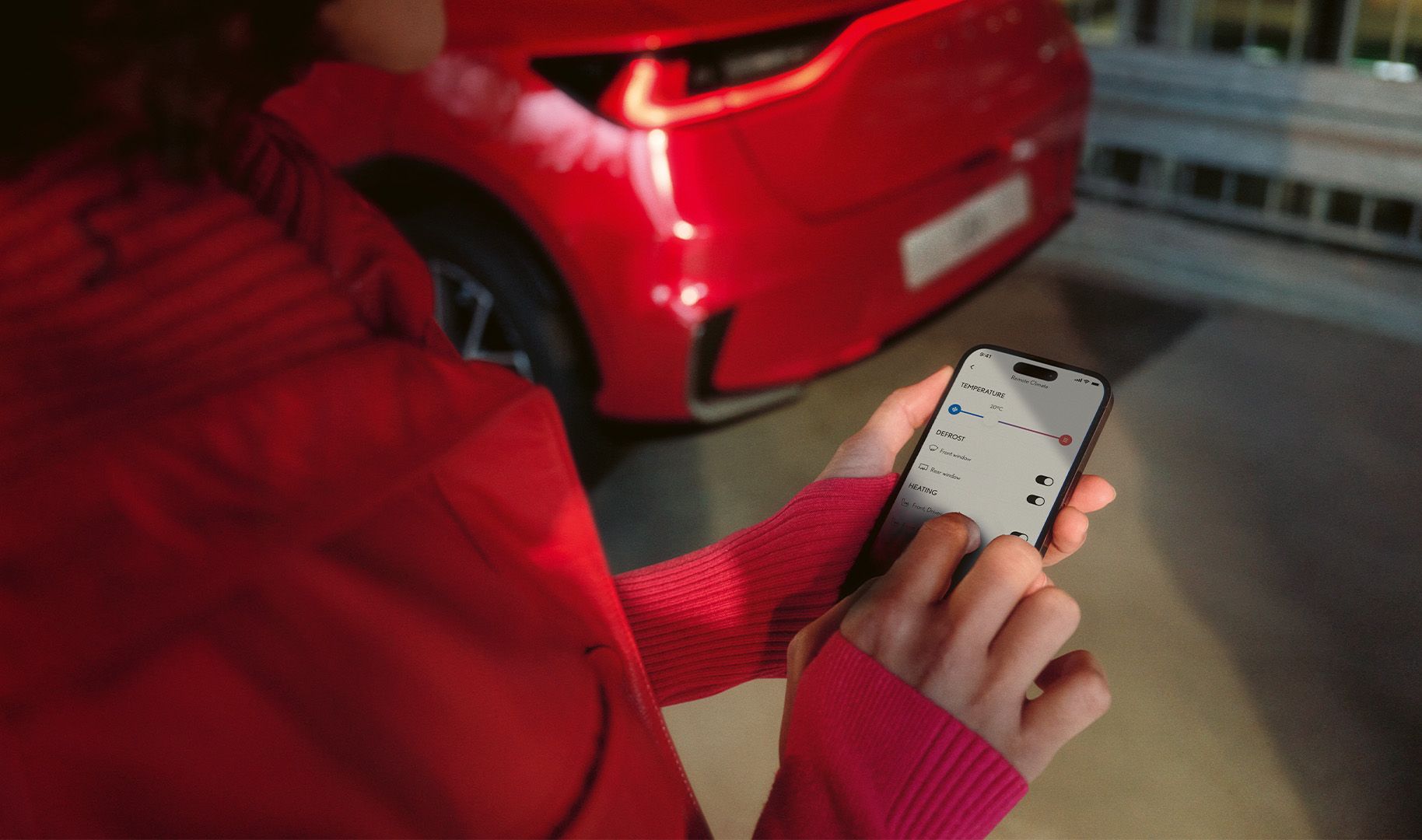 A person using a mobile phone to access the Lexus Link+ app