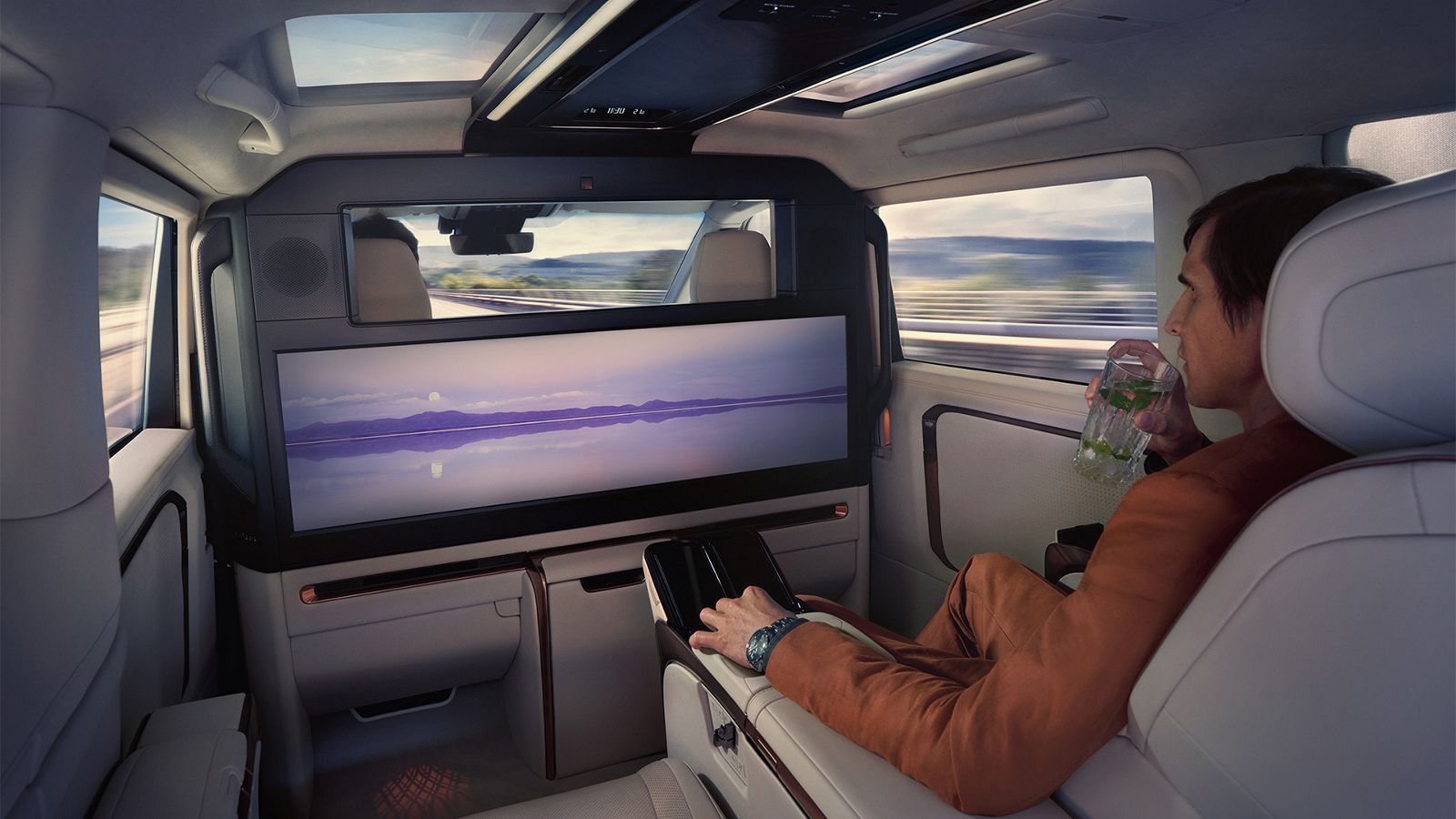 Person sitting in the rear passenger seat of a Lexus LM