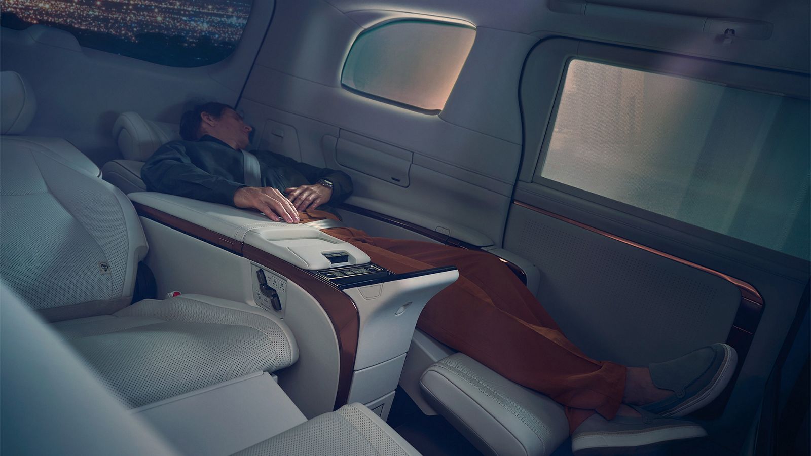 Person fully reclining in a Lexus LM seat