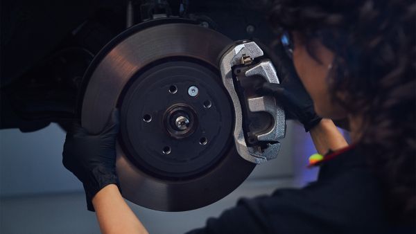 A mechanic working on a Lexus