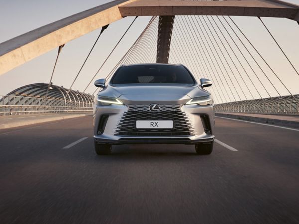 A Lexus RX driving over a bridge
