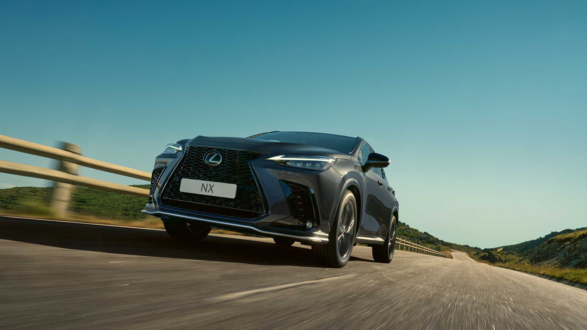 Front three quarter angle of a Lexus NX driving on a road