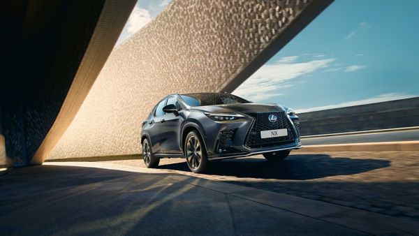 Front-lower angle of a Lexus NX driving on a road
