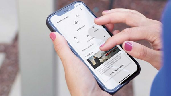 A person using a mobile phone to access the Lexus Link+ app