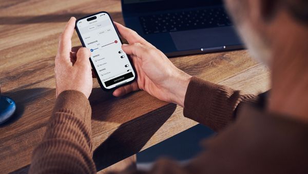 A person using a mobile phone to access the Lexus Link+ app