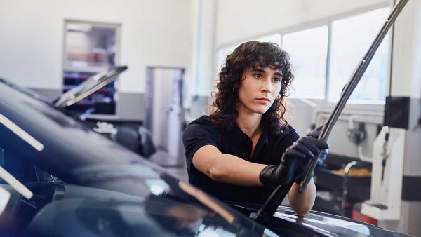 Lexus technician adjusting a cars wiper blade 