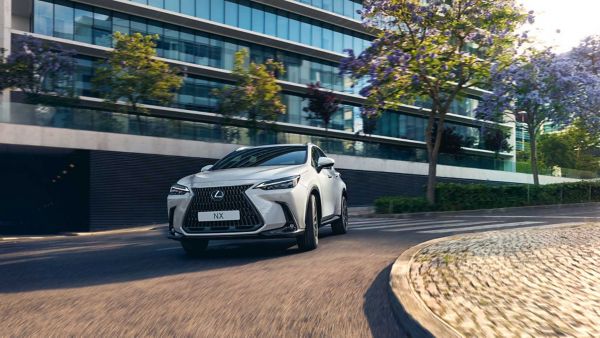 Lexus NX driving in a town