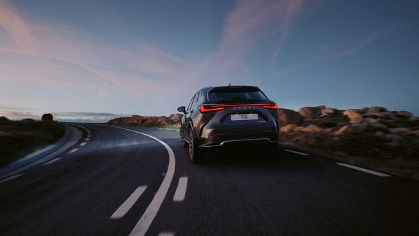 A Lexus NX driving on a road