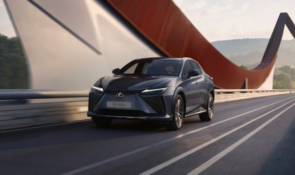 A Lexus RZ driving over a bridge