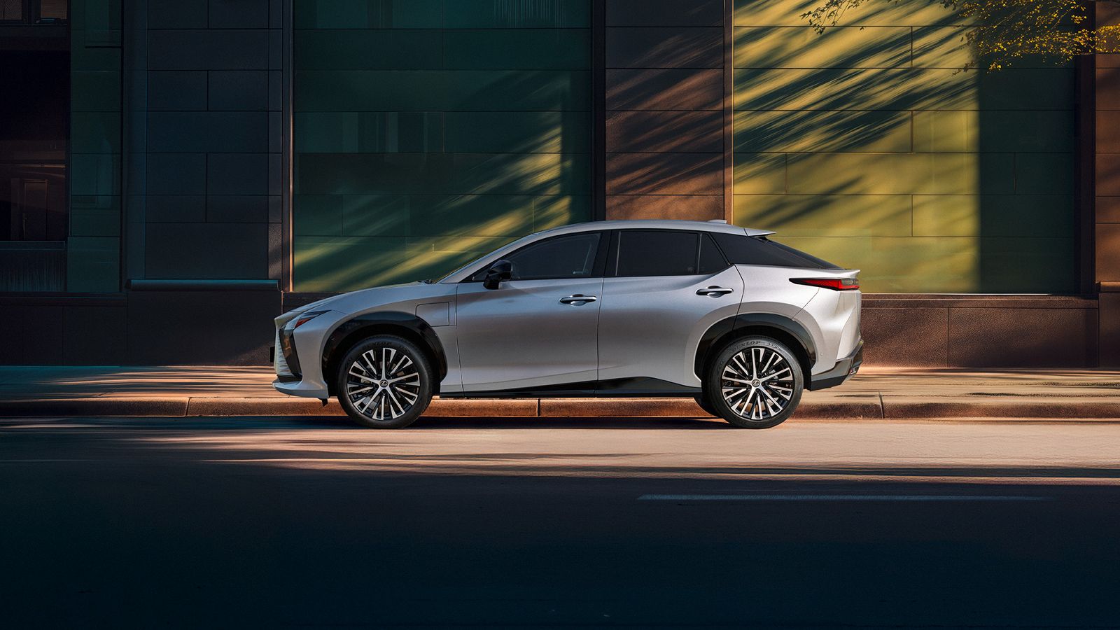 A Lexus RZ driving on a road