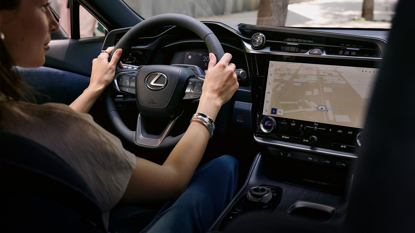 A person driving a Lexus RZ