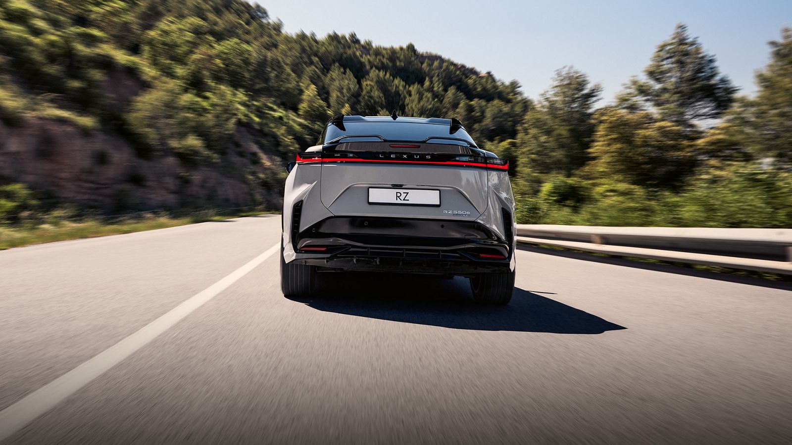A Lexus RZ driving on a road