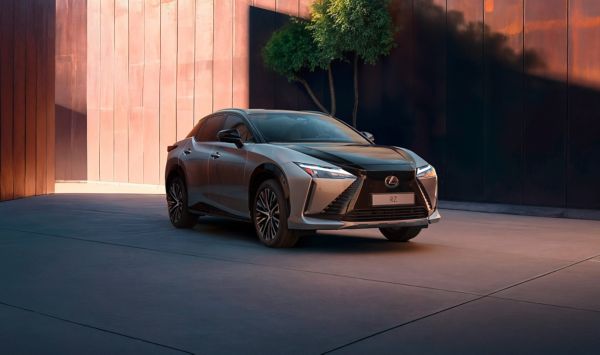 A Lexus RZ parked outside a building