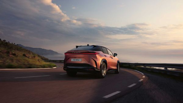 A Lexus RZ driving on a rural road