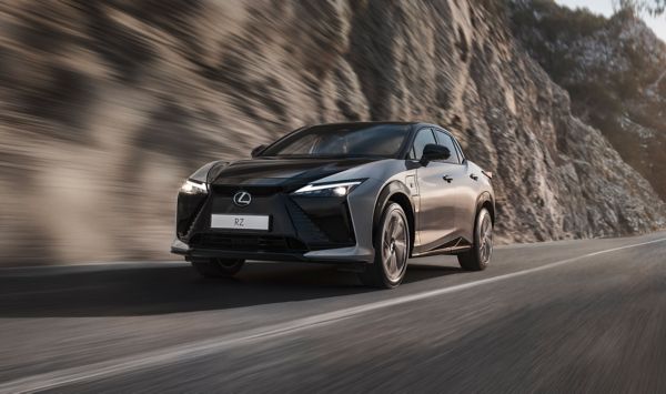 A Lexus RZ parked outside a building