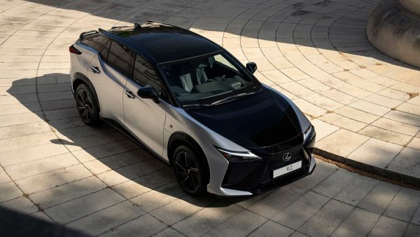 Raised rear three-quarter angle of a parked all-new Lexus RZ