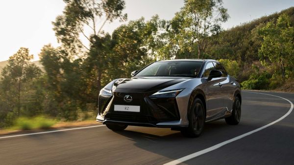 An all-new Lexus RZ driving on a rural road