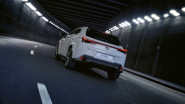 A Lexus UX driving through a tunnel