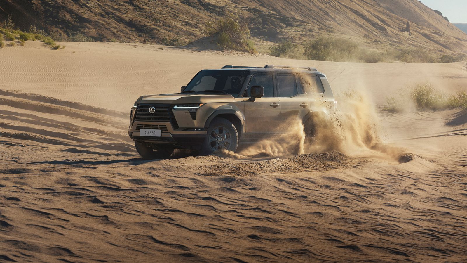 A Lexus GX driving through sand