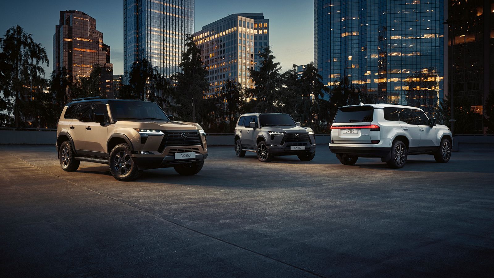 Three Lexus GX parked in a city setting