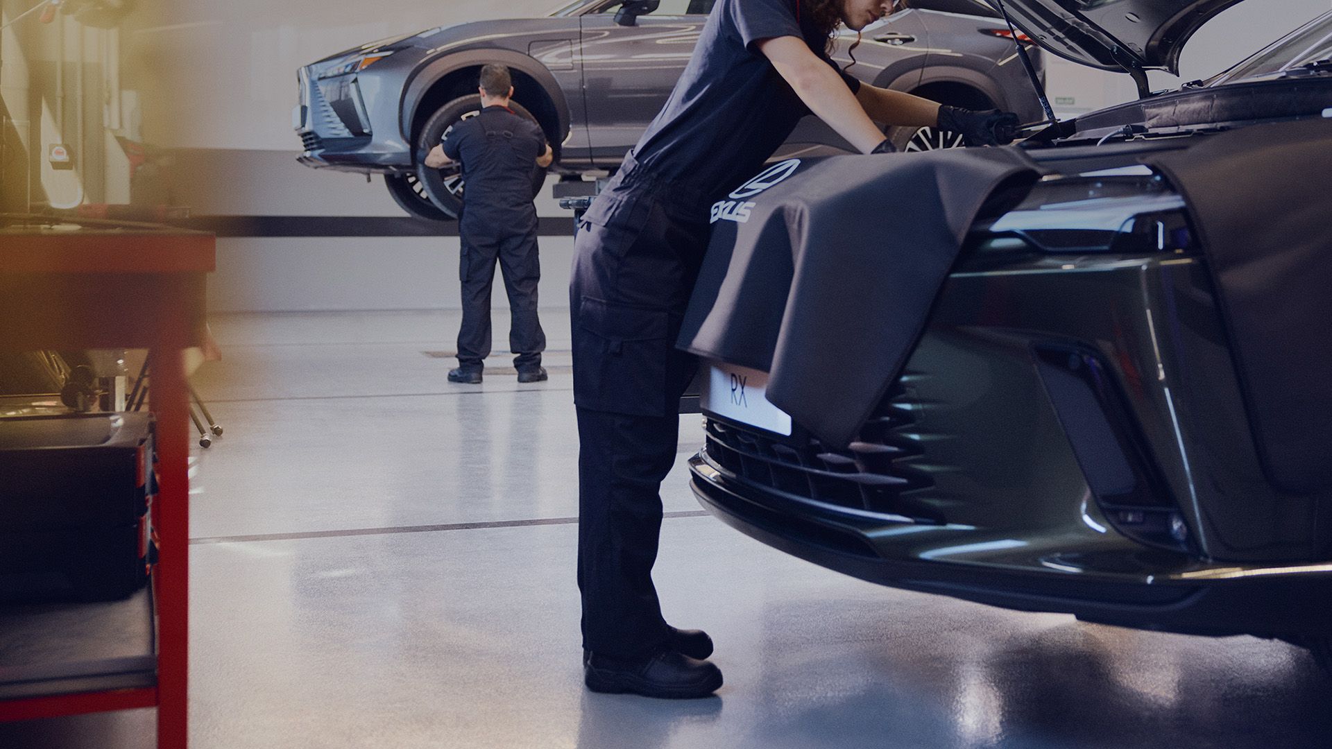 A mechanic inspecting a Lexus