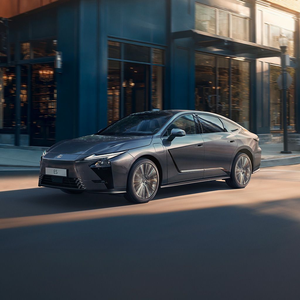 Side view of a Lexus ES driving on a city street