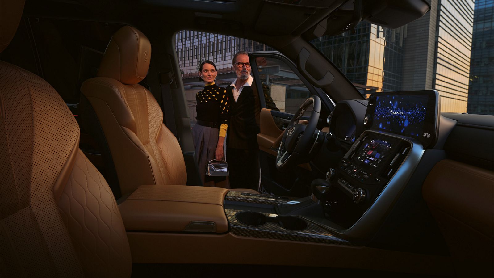 Two people stood in the doorway of a Lexus LX